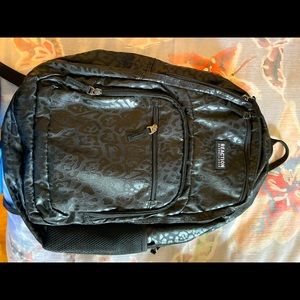 Reaction Kenneth Cole black cheetah backpack